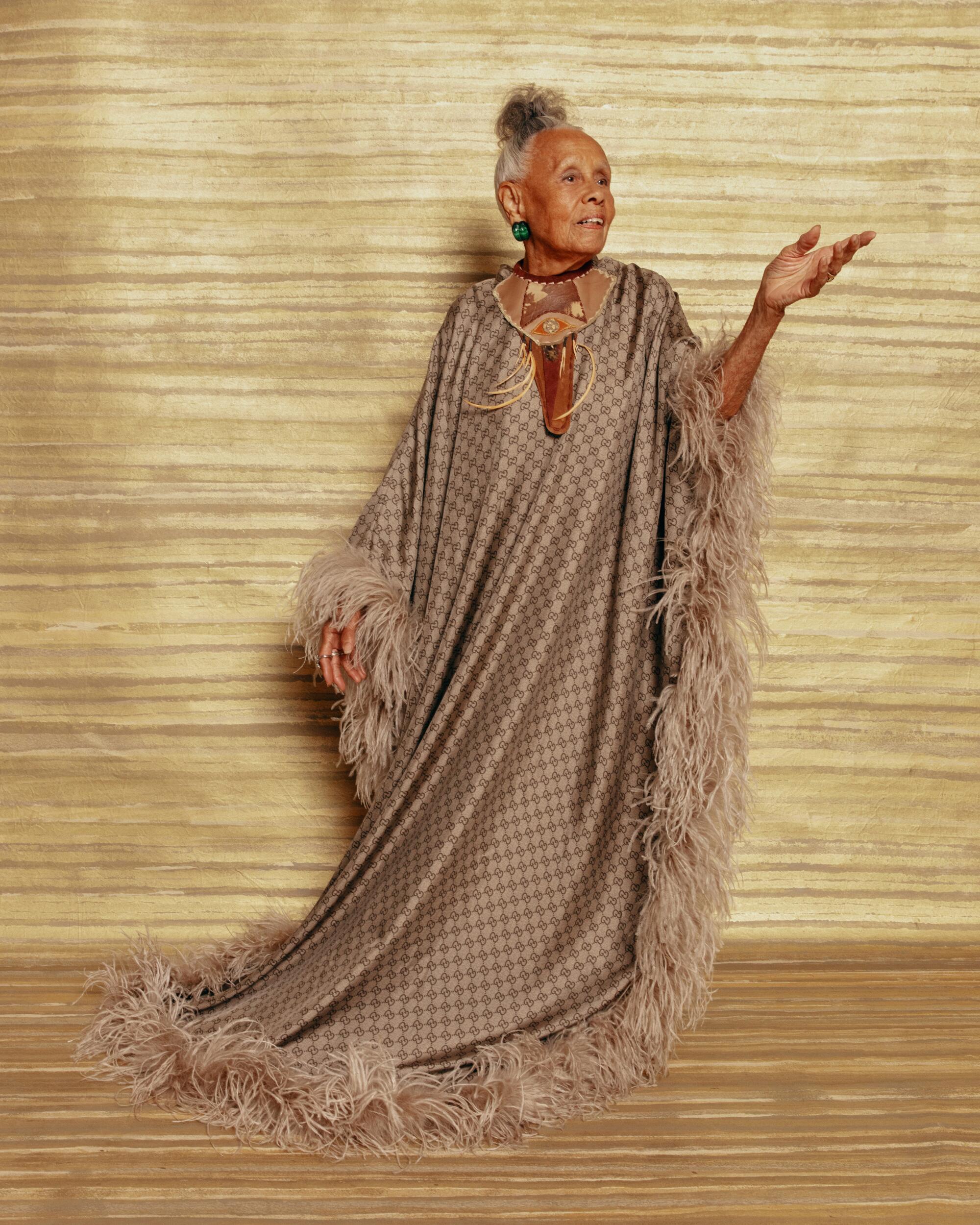 Betye Saar wears a Gucci kaftan, the artist’s own archival “Mojo necklace” from 1974 and Patricia Von Muslin jewelry.