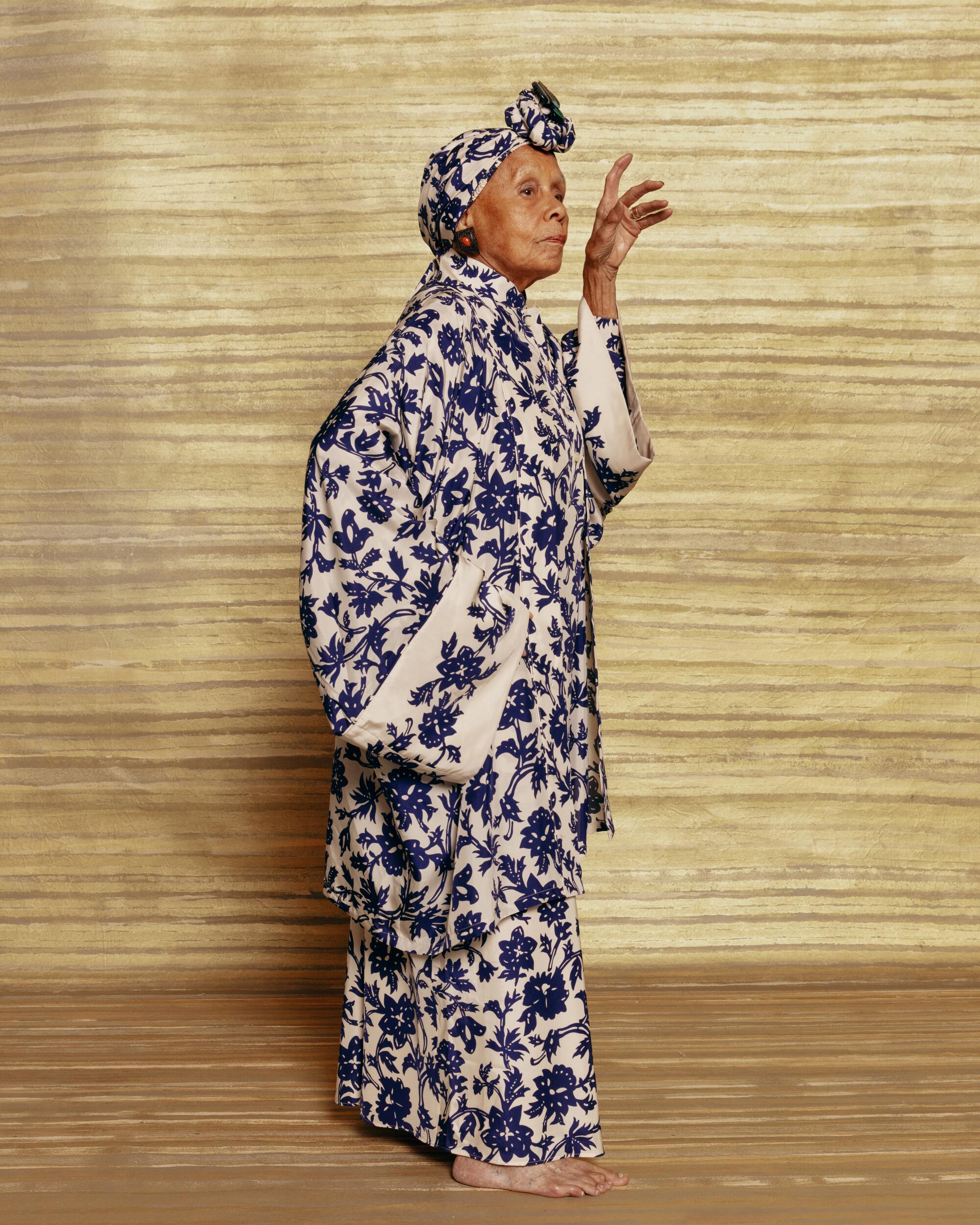 Saar wears a Loro Piana robe, skirt and pants as headwrap, the artist’s own archival brooch from the 1980s-90s and Patricia