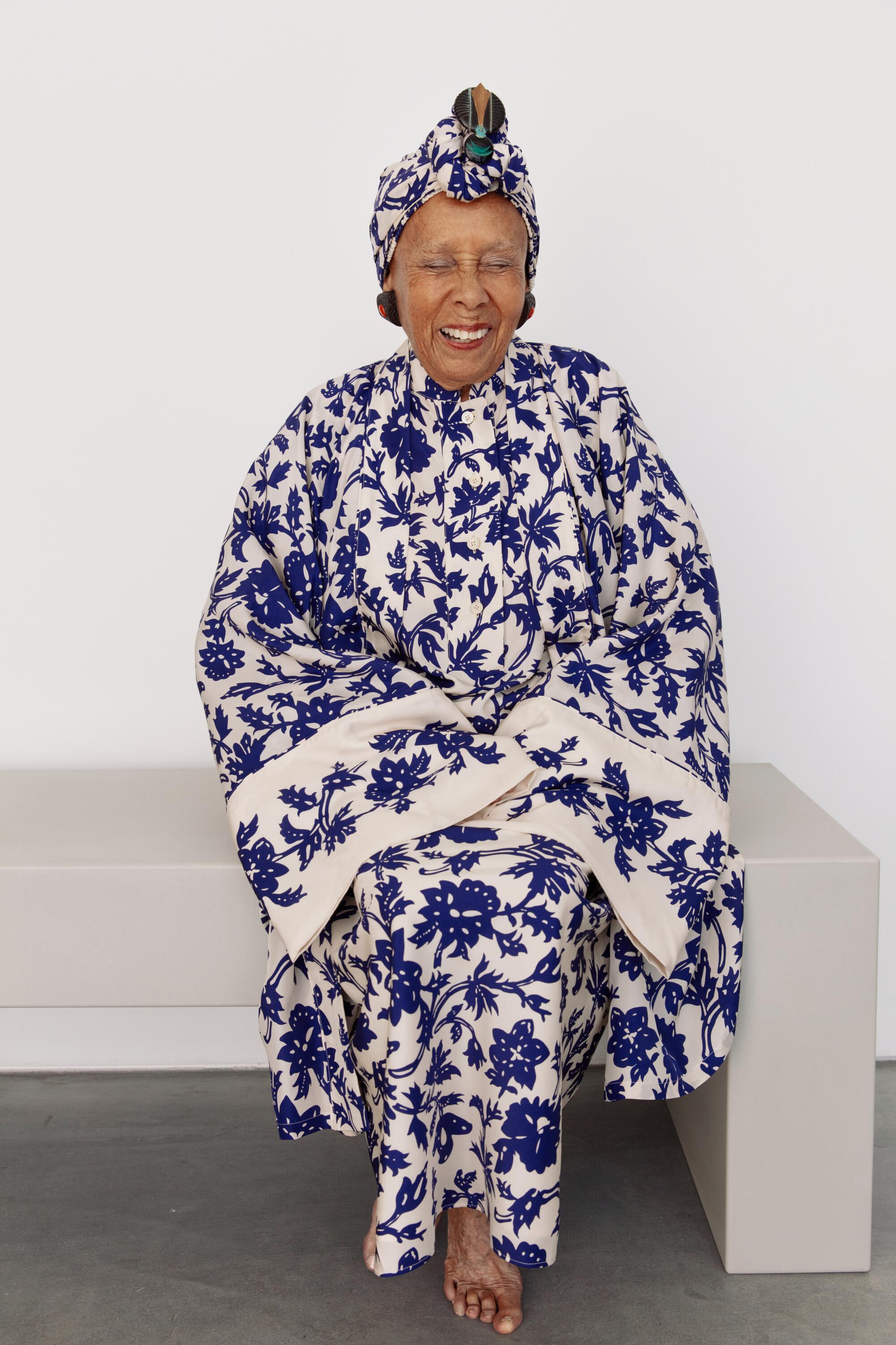 Saar wear a Loro Piana robe, skirt and pants as headwrap, the artist’s own archival brooch from the 1980s-90s and jewelry