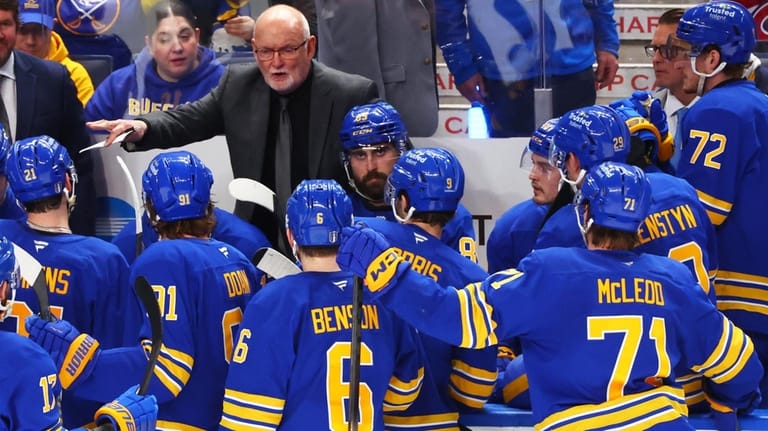 Buffalo Sabres head coach Lindy Ruff speaks with team during...