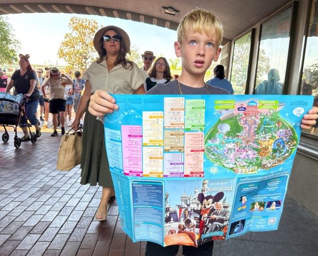 Connor Nyhus holds on to his commemorative map during the 70th anniversary Disneyland on July 17, 2025, ￼ in Anaheim, CA. ￼ (Photo by Jeff Gritchen, Orange County Register/SCNG)
