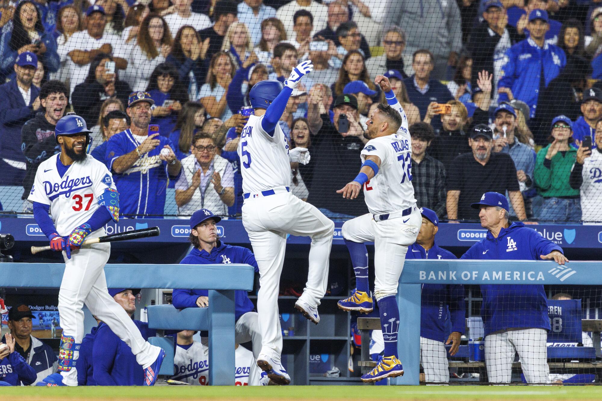 Freddie Freeman, left, celebrates with Miguel Rojas after hitting his 100th home run as a Dodger.