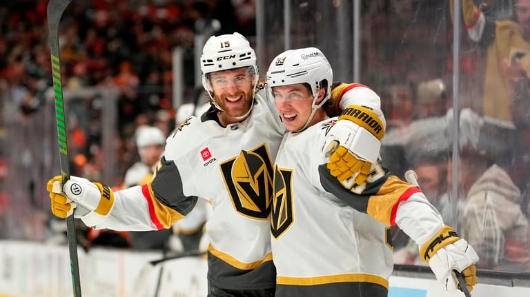 Vegas Golden Knights right wing Mitch Marner, right, celebrates his...