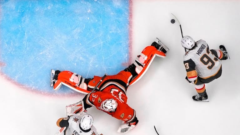 Vegas Golden Knights right wing Mitch Marner, right, scores on...