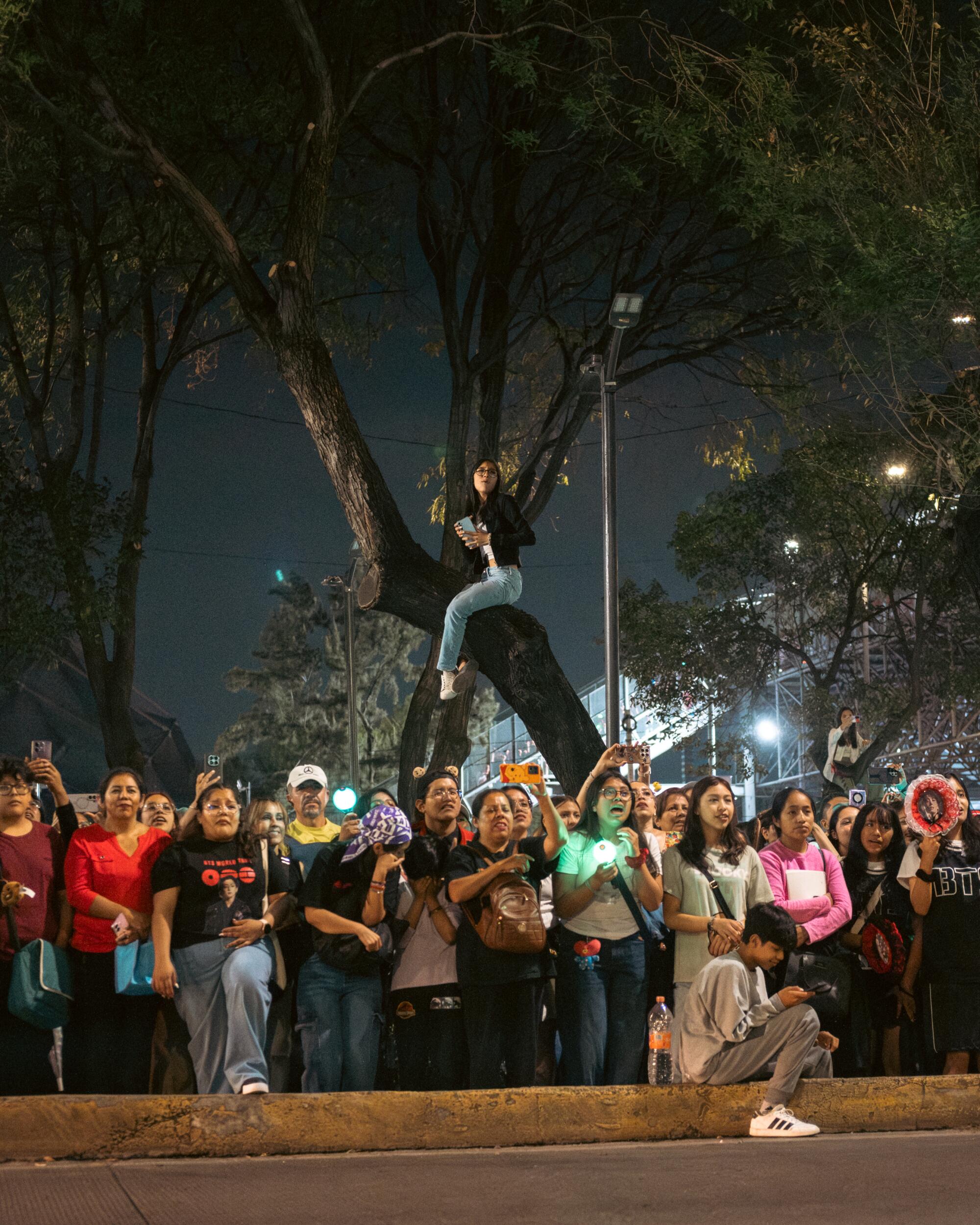 Fans watch from elevated the street