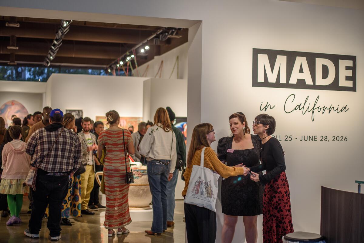Brea Gallery director, Katie Chidester (center) welcomes people to “Made in California."