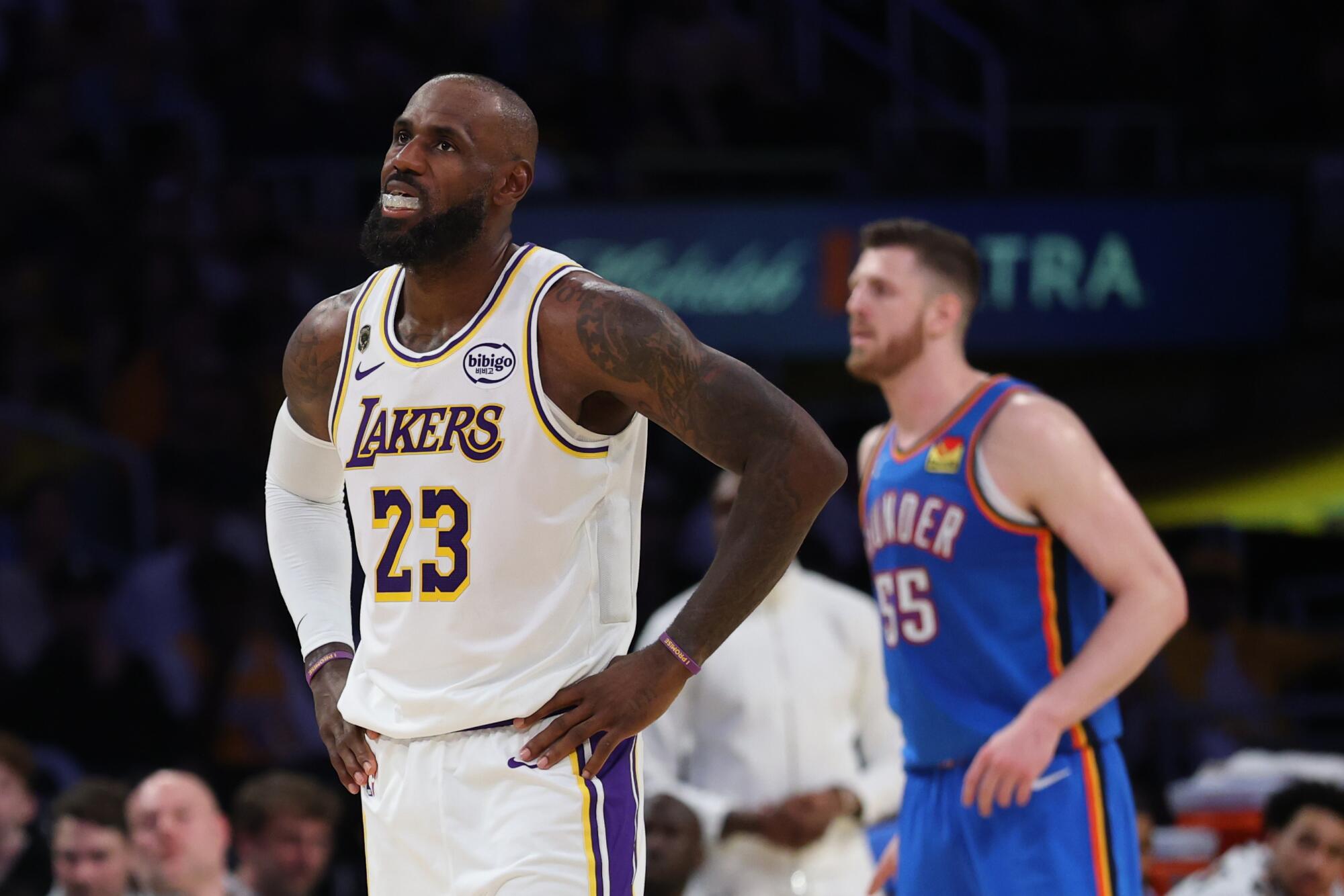  Lakers forward LeBron James catches his breath during a break in play against the Thunder in Game 3 on Saturday night.