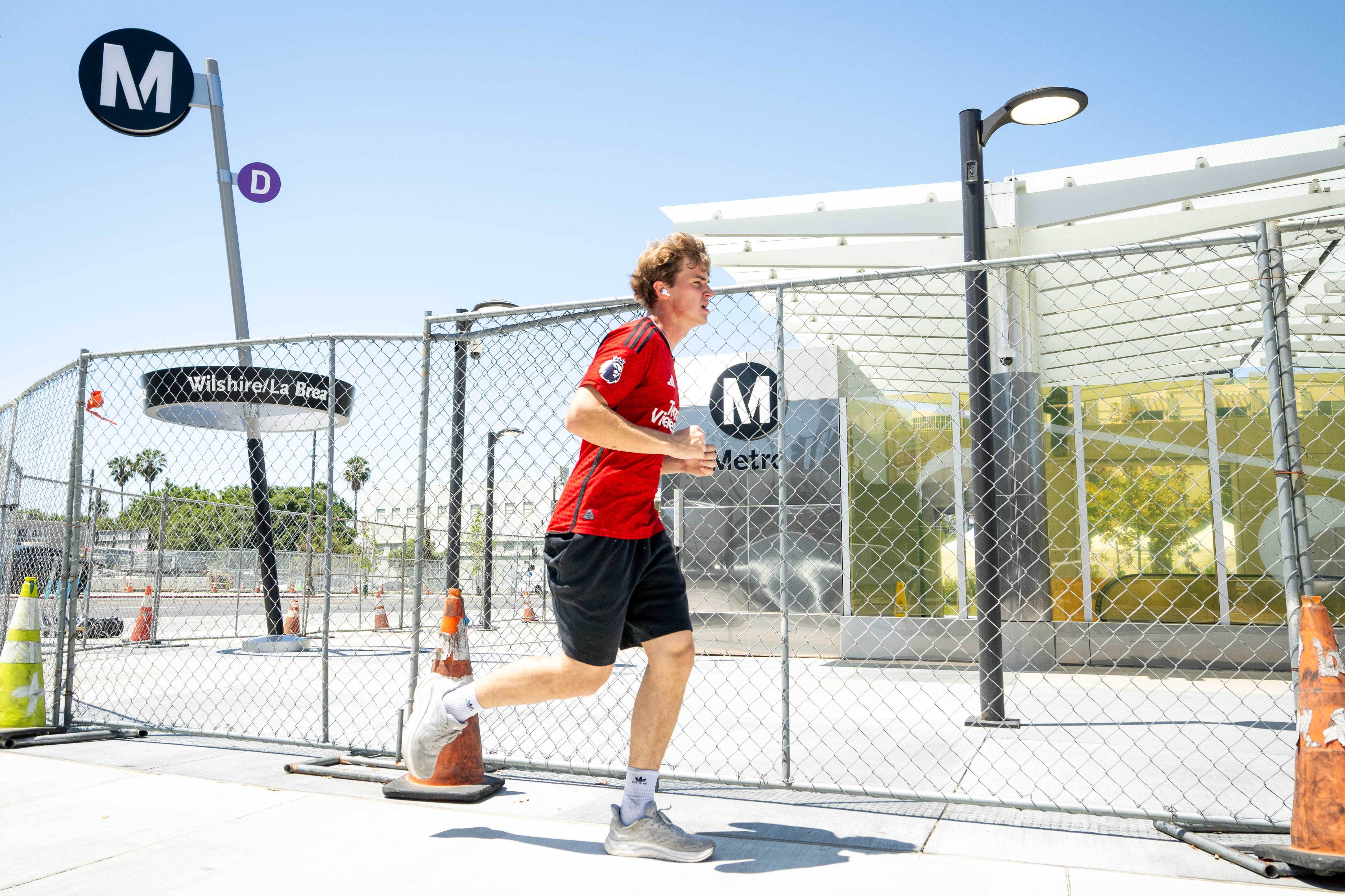 A runner passes the Metro D Line subway extensionâs Wilshire/La...