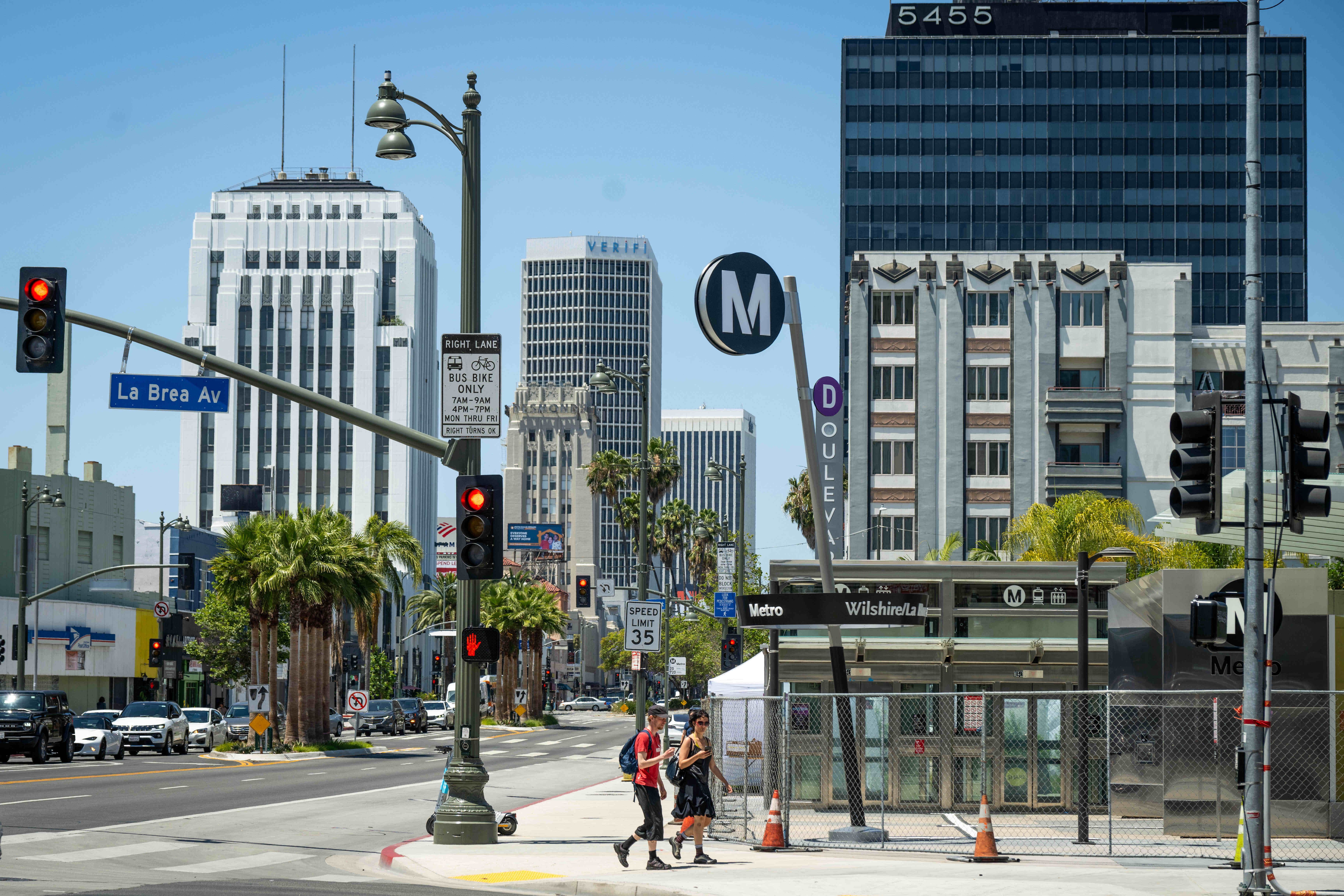 People walk past the Metro D Line Subway Extensionâs Wilshire/La...