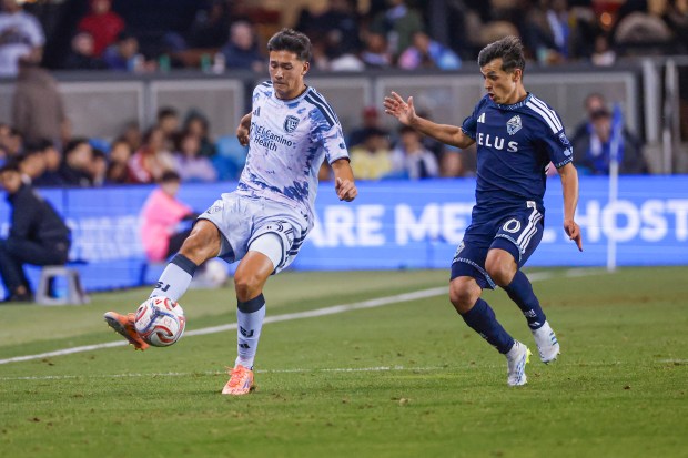 San Jose Earthquakes' Beau Leroux (34) passes the ball against Vancouver Whitecaps' Andrés Cubas (20) during the second half at PayPal Park in San Jose, Calif., on Saturday, May 9, 2026.  (Shae Hammond/Bay Area News Group)