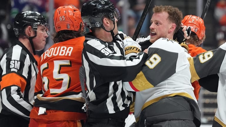 Vegas Golden Knights' Jack Eichel (9) is separated from Anaheim...
