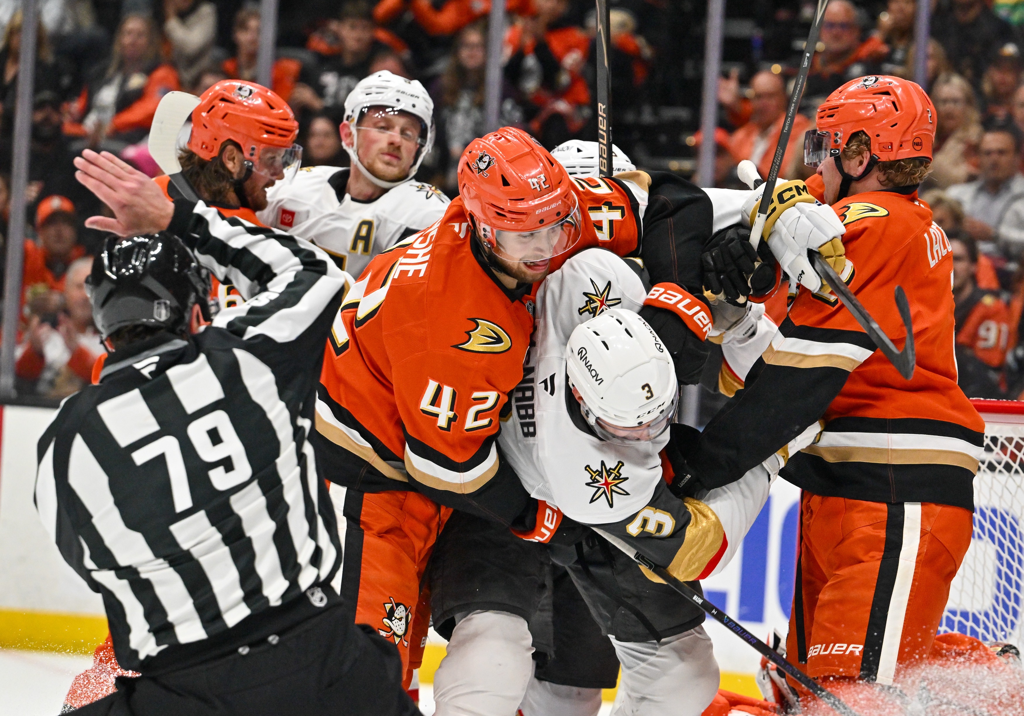 The Ducksâ Tim Washe (42) and Vegas Golden Knightsâ Brayden...