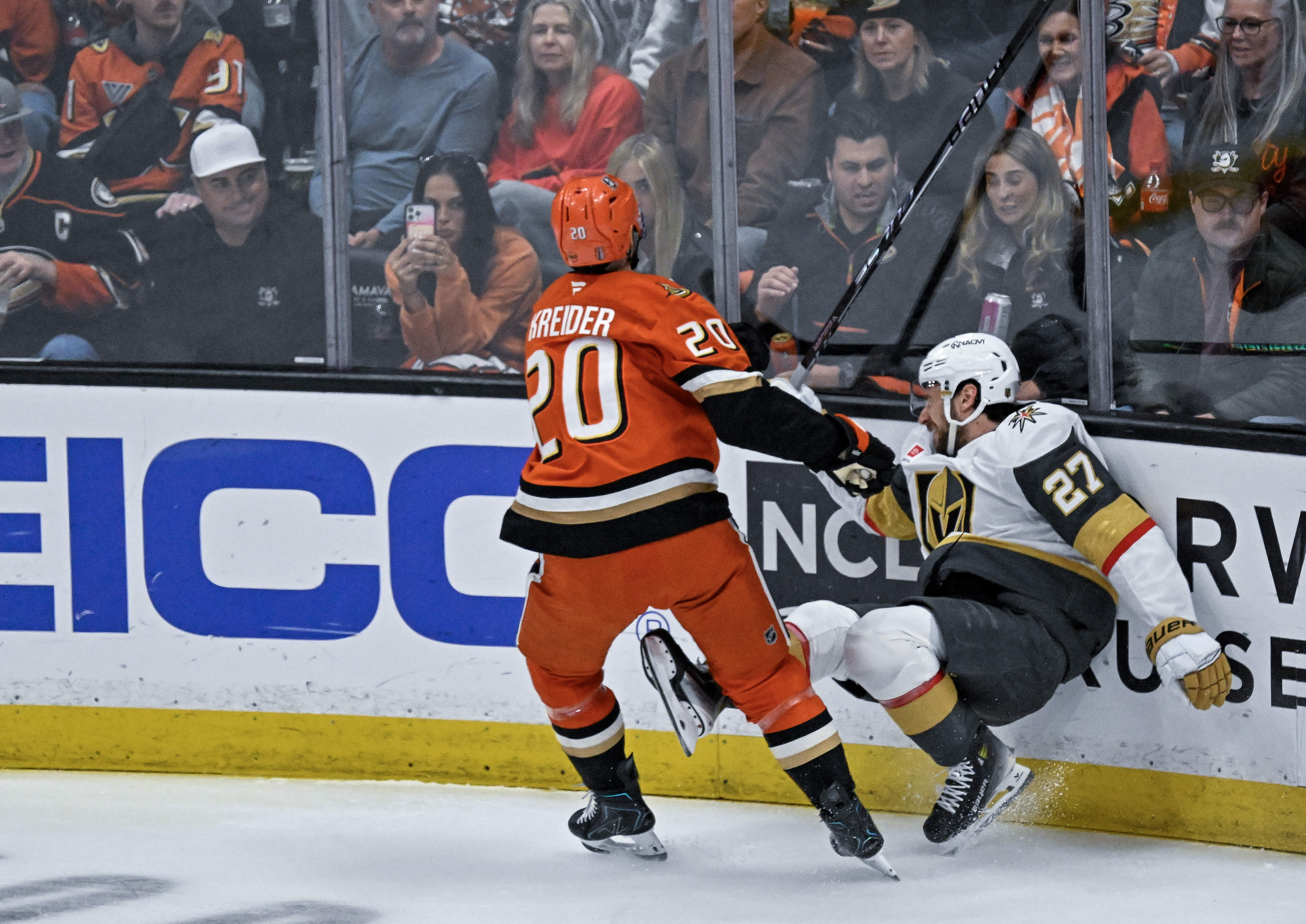 The Ducksâ Chris Kreider (20) checks the Golden Knightsâ Shea...