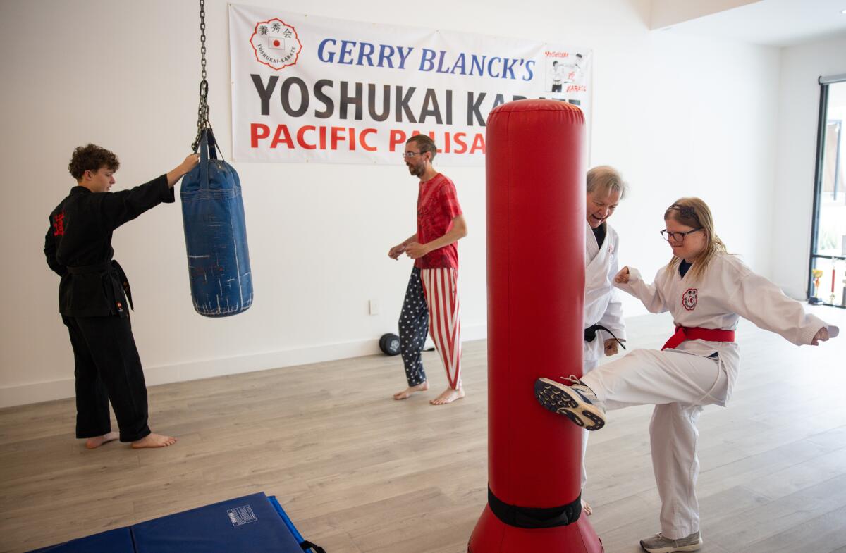 People practice martial arts skills at the studio
