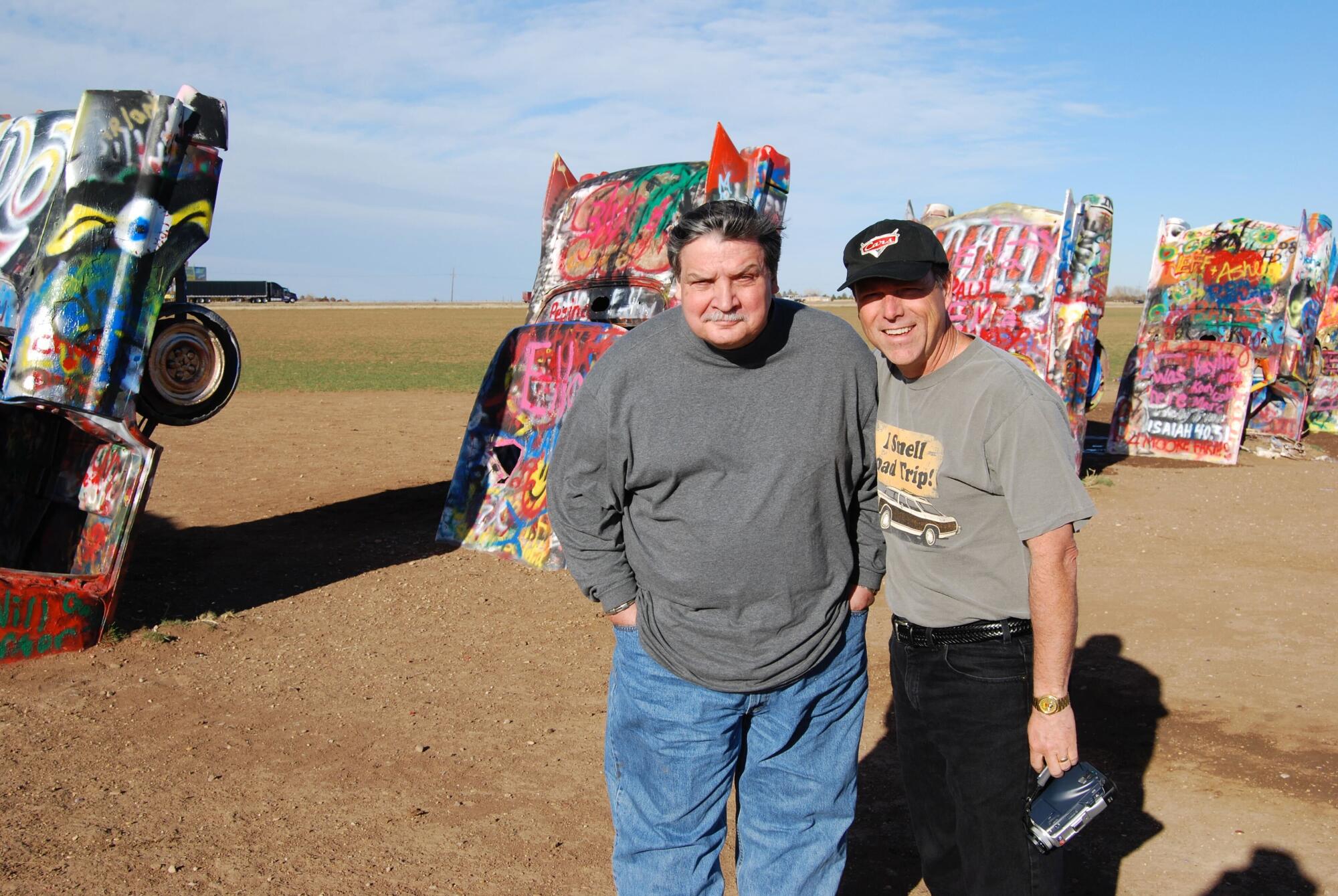 Tour guide Michael Wallis, left, and Walt Disney Imagineer Kevin Rafferty during a research trip at Cadillac Ranch in 2008.