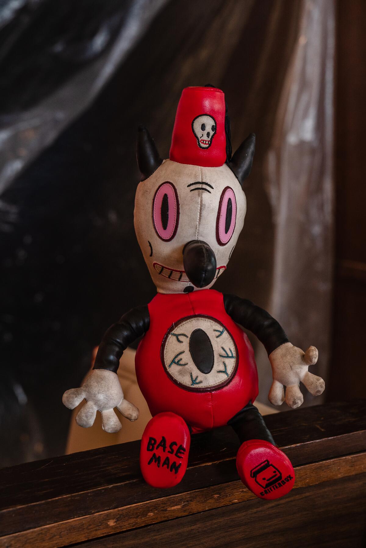 A stuffed toy with a fez hat.