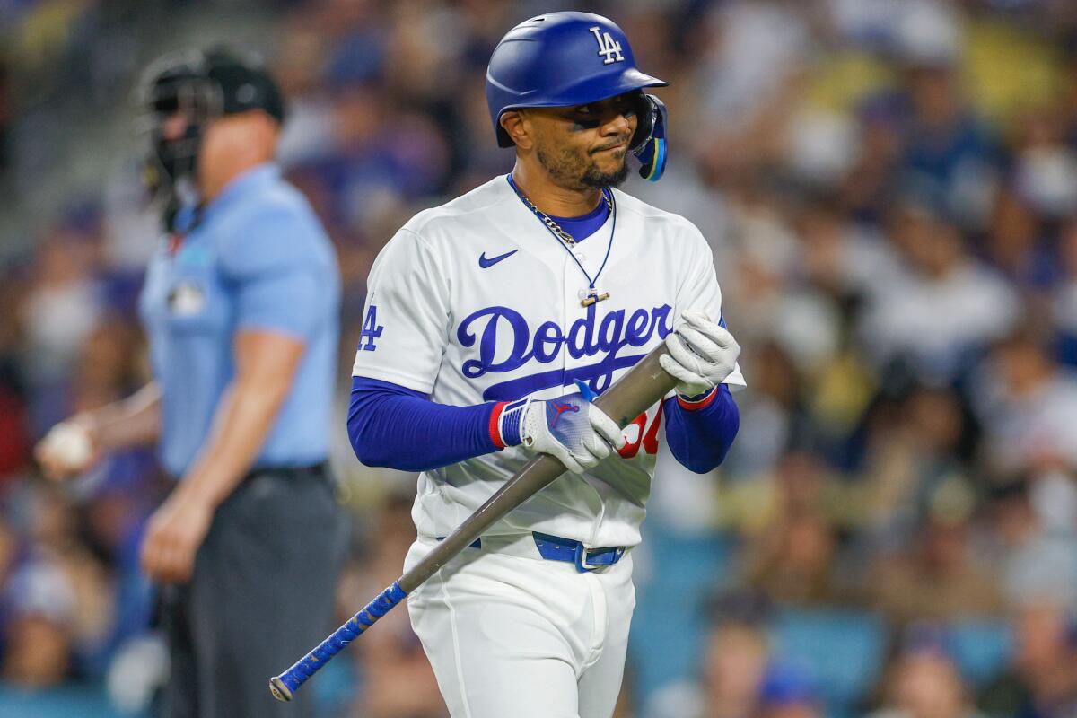 Dodgers shortstop Mookie Betts reacts after striking out against the Giants at Dodger Stadium.