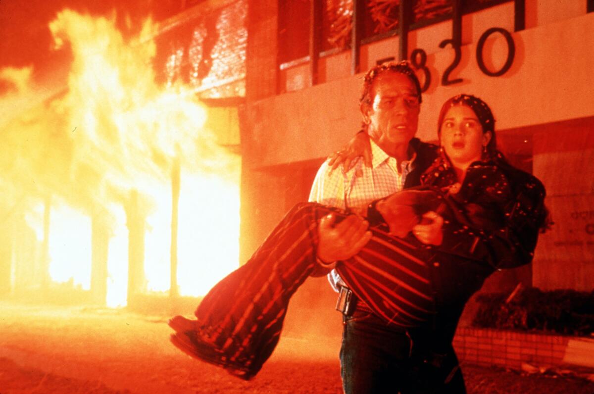 Tommy Lee Jones flee from the deadly destruction of lava in Wilshire Boulevard . 