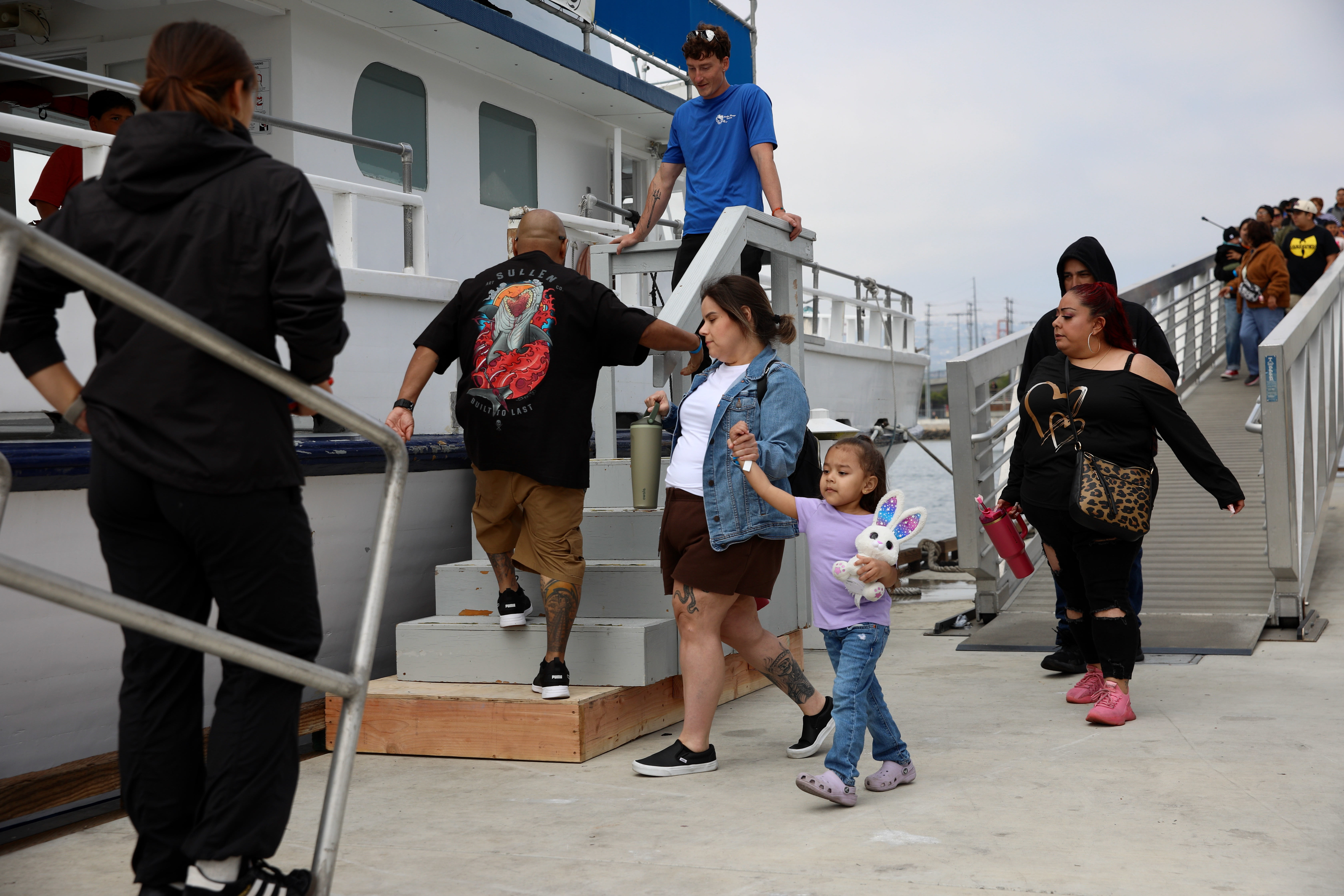 Passengers board a boat to tour Los Angeles Harbor on...