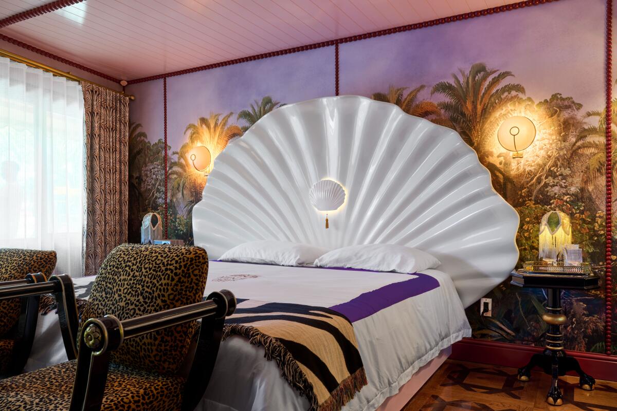 Fiberglass clamshells serve as headboard in guest rooms.