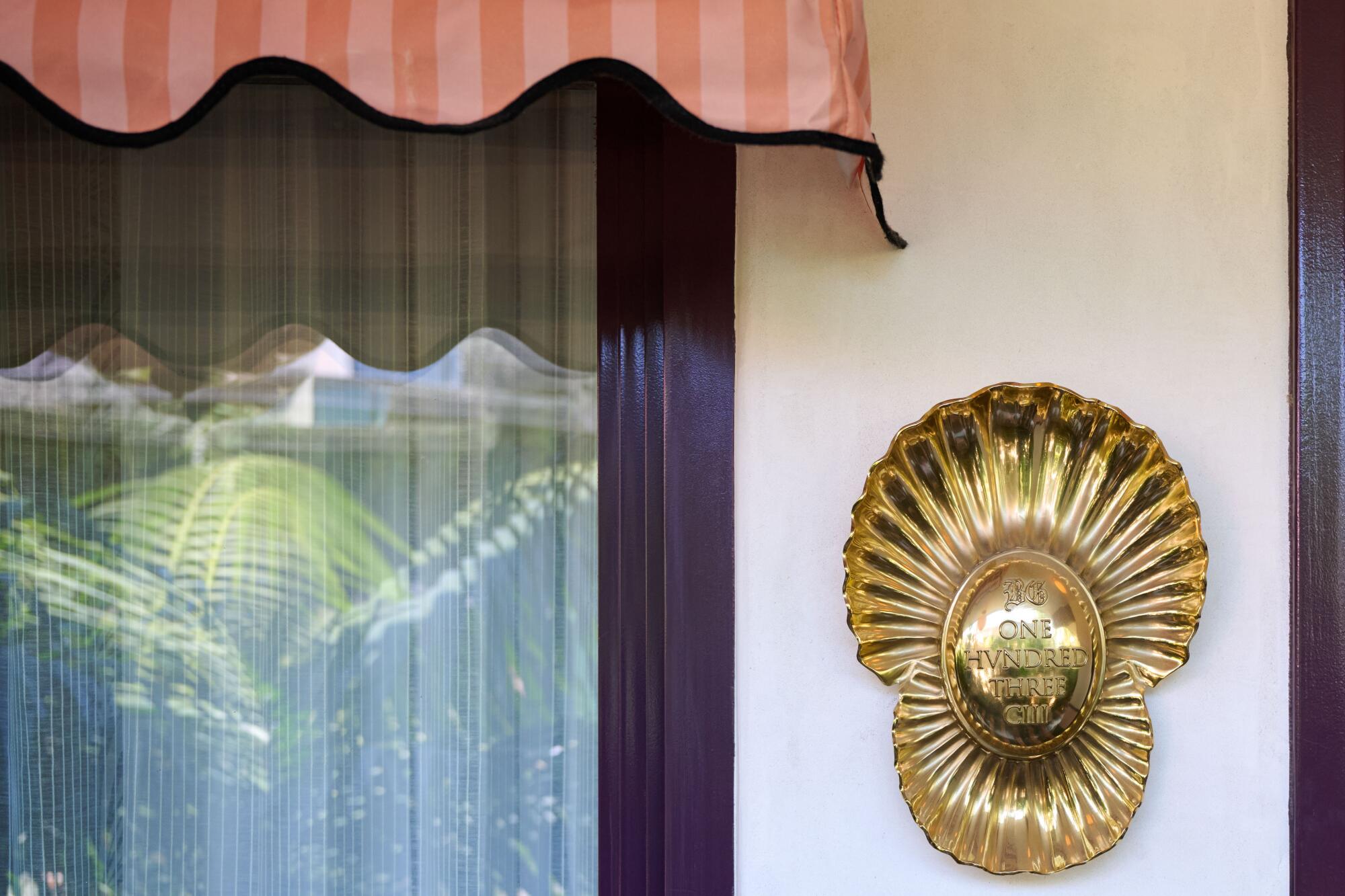 Guest rooms, including No. 103, are labeled with inscribed brass clamshells.