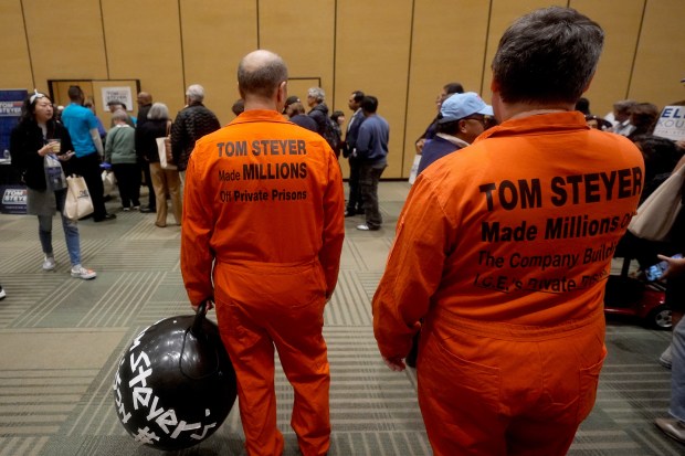 People protest outside of a lunch held by California gubernatorial candidate Tom Steyer at the 2026 California Democratic Party State Convention in San Francisco, Saturday, Feb. 21, 2026. (AP Photo/Jeff Chiu)