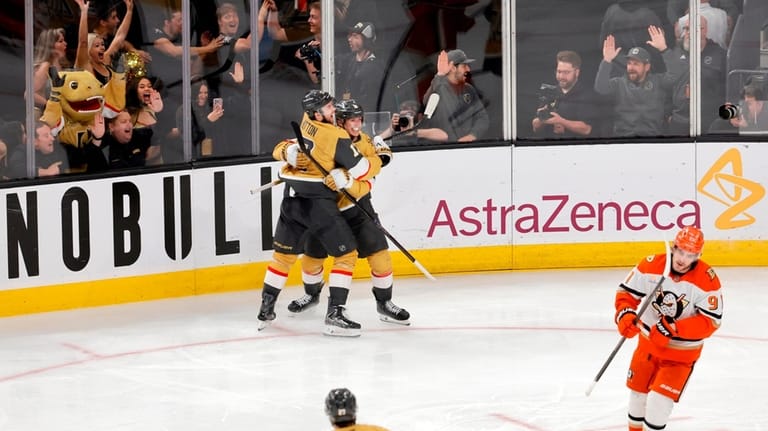 Vegas Golden Knights right wing Pavel Dorofeyev, center right, celebrates...