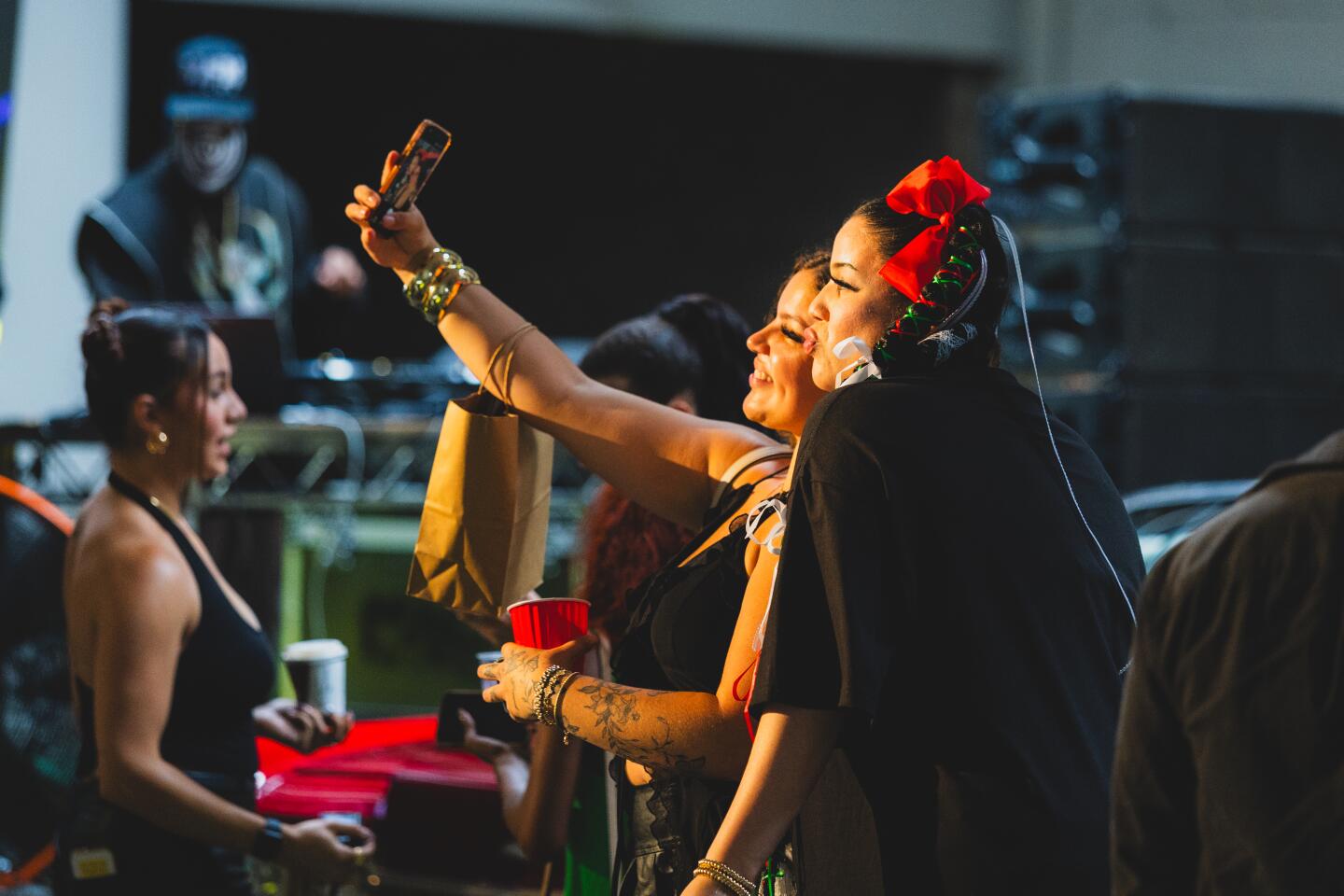 DJ Stalli (right) takes a selfie with a friend at the Lucha Experience by MFN Lucha on Sunday, May 3, 2026