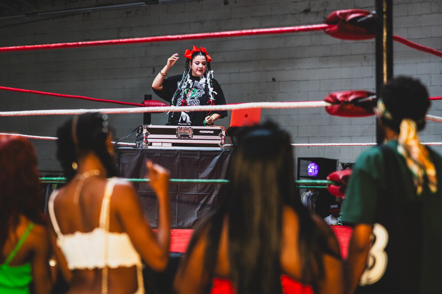 DJ Stalli spins at the Lucha Libre Art Show on Sunday, May 3, 2026, in Los Angeles.