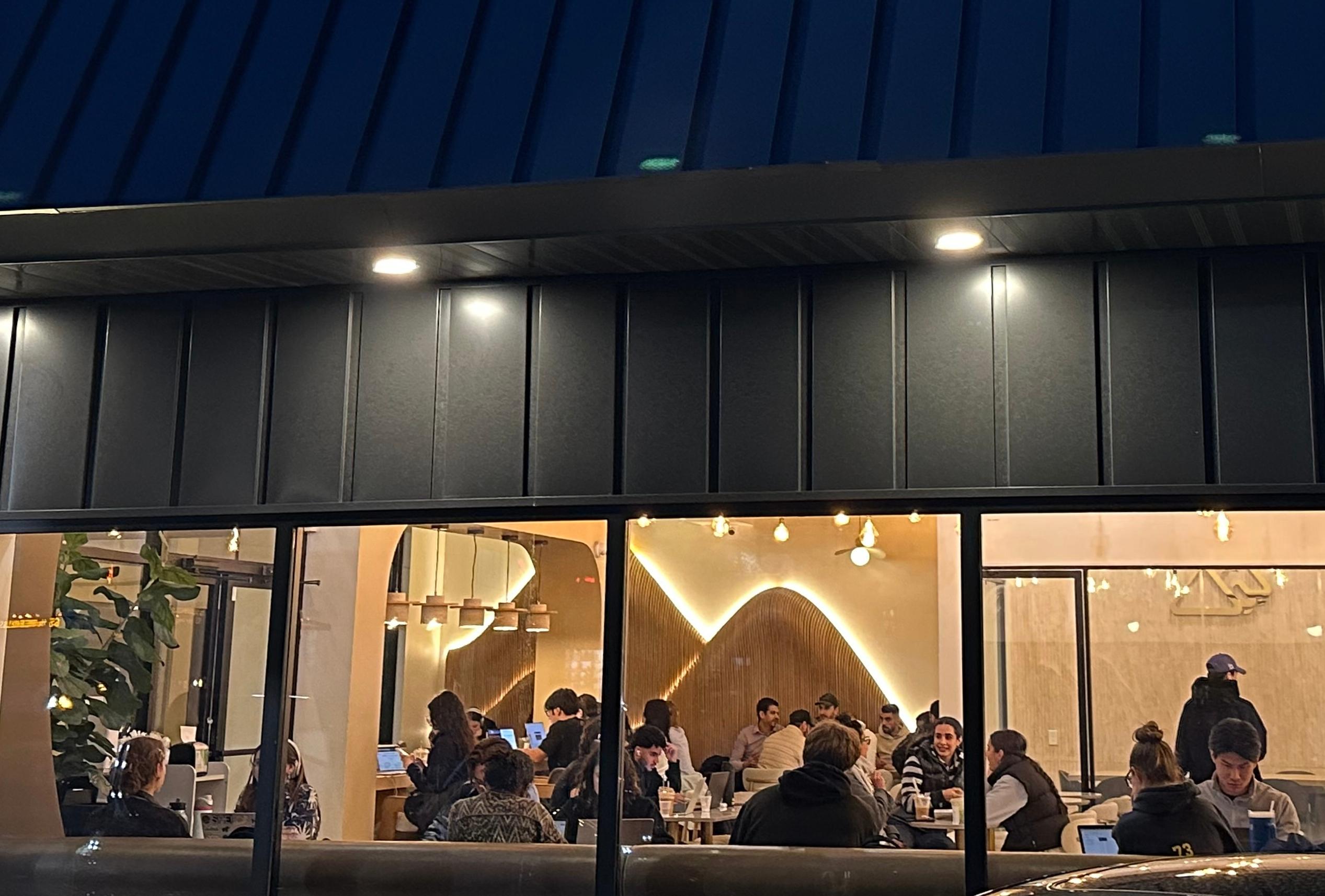 Customers sit inside Jabal Coffee House in Ann Arbor, Mich.,...