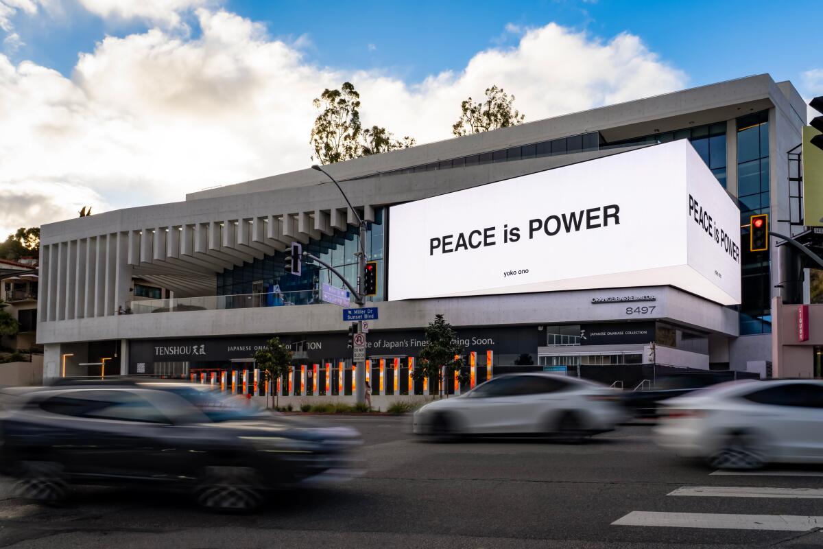 A digital billboard promoting peace as part of the Broad museum's upcoming exhibition, "Yoko Ono: Music of the Mind."