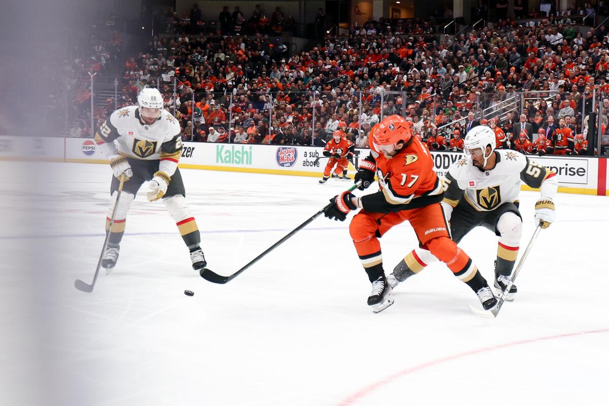 Ducks left wing Alex Killorn moves the puck ahead of Vegas right wing Keegan Kolesar in the first period.