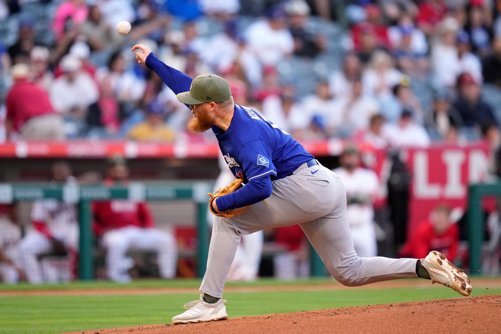 Dodgers pitcher Will Klein delivers during the first inning against the Angels at Angel Stadium on Friday.