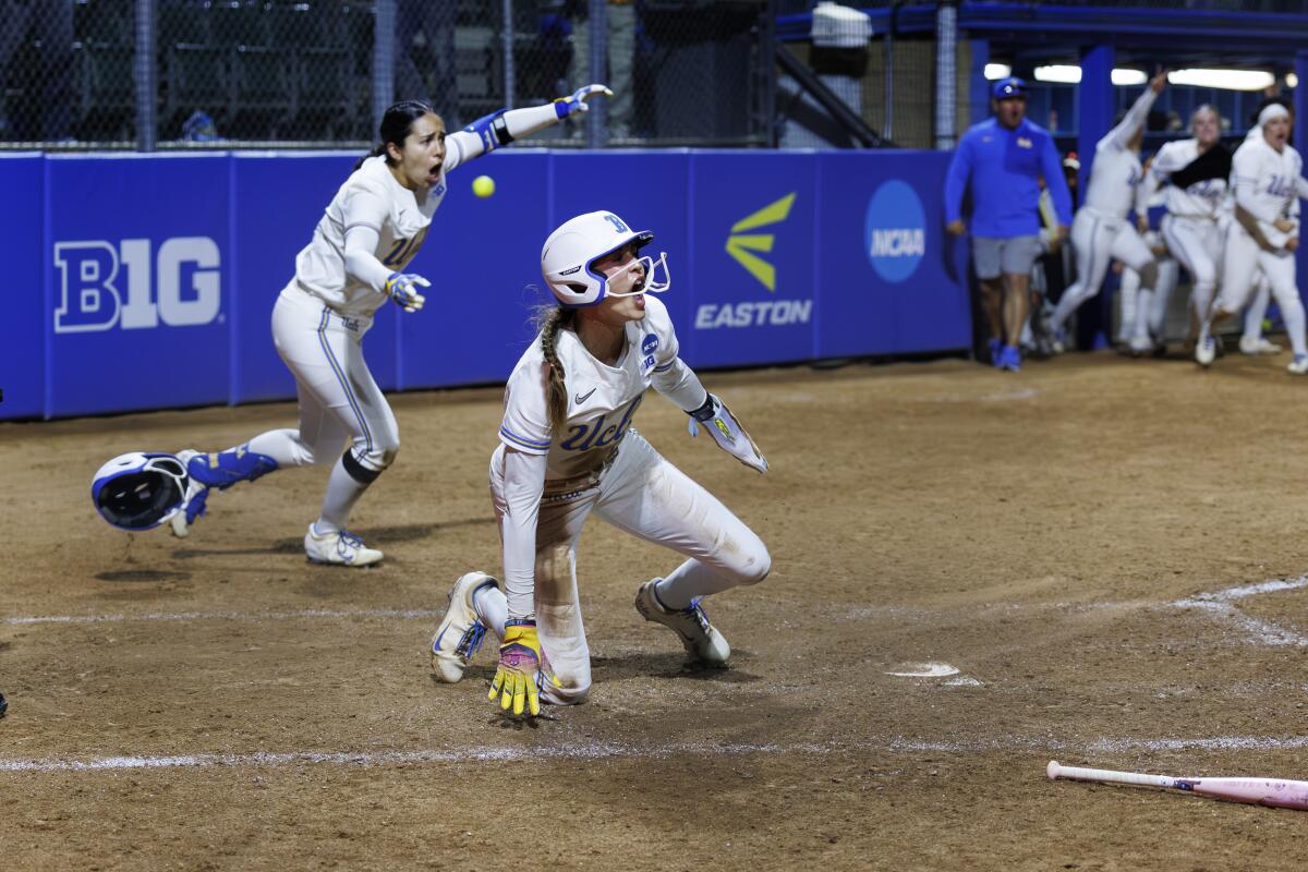 UCLA's Rylee Slimp and Bri Alejandre react after scoring the winning run against California Baptist on Friday.