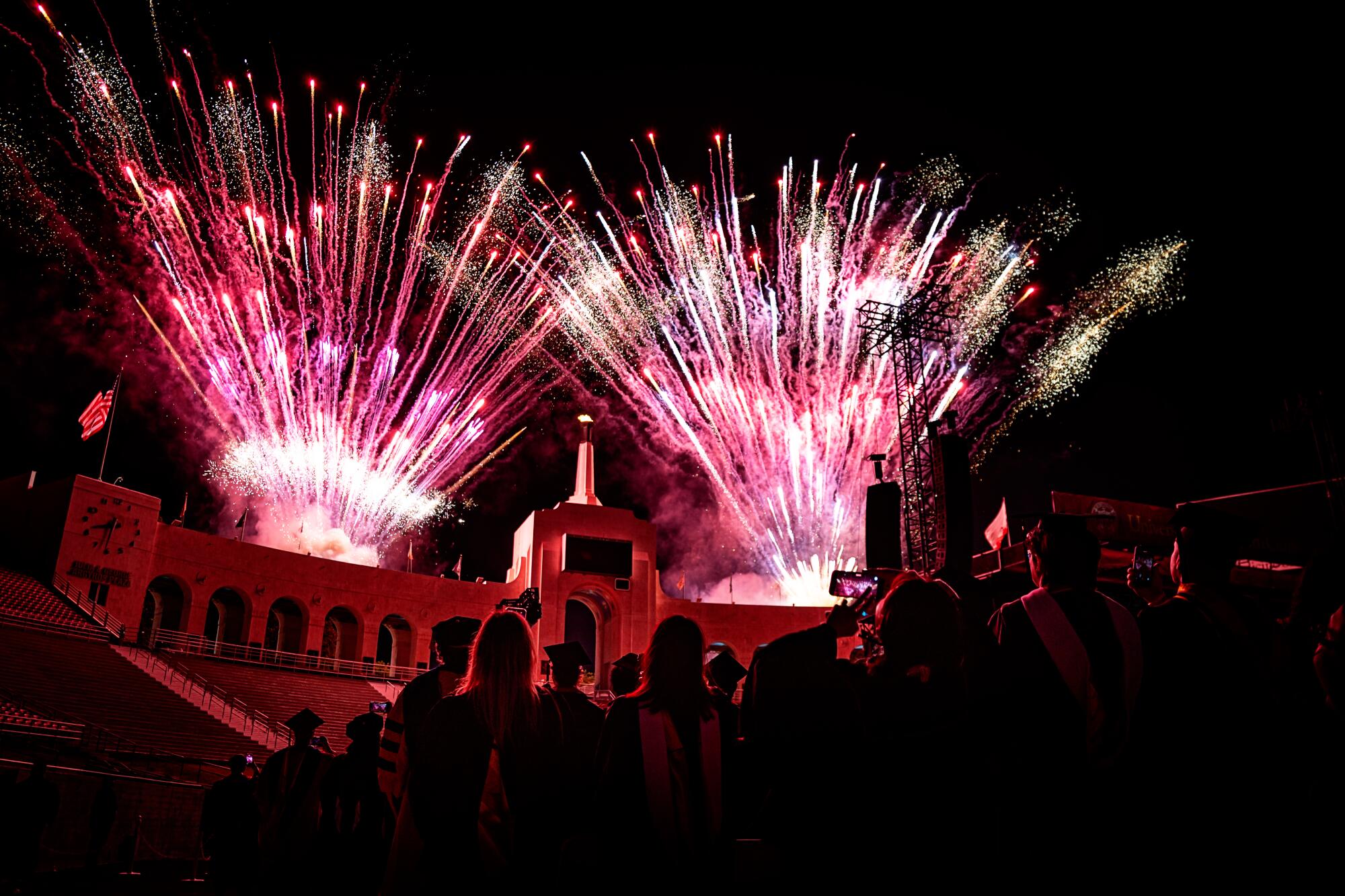 USC graduates watch the fireworks at the end of their 2026 commencement ceremony.