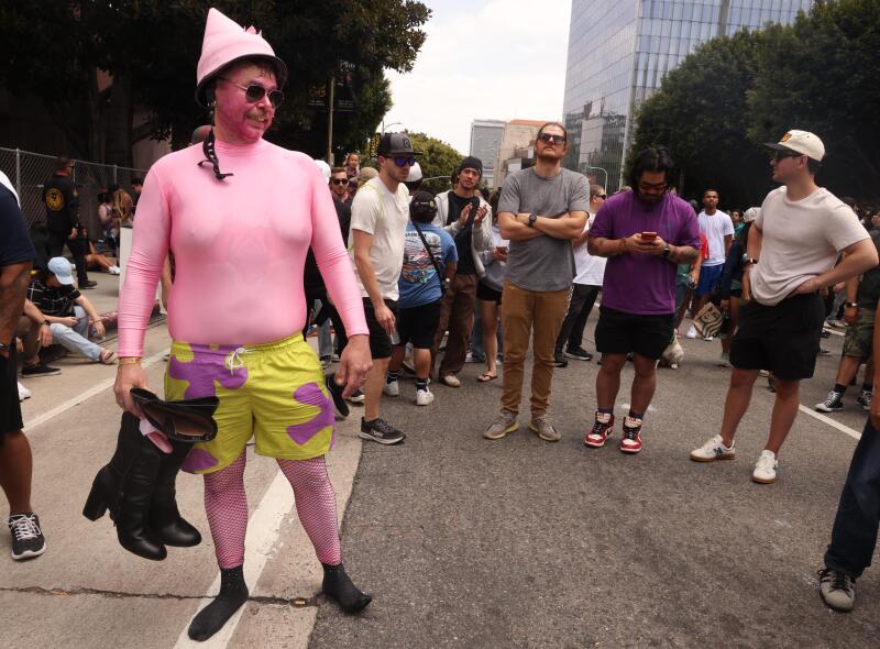 Joshua Thomas, a member of The Krusty Krew, "Patty Wagon, walks in the crowd after competing.