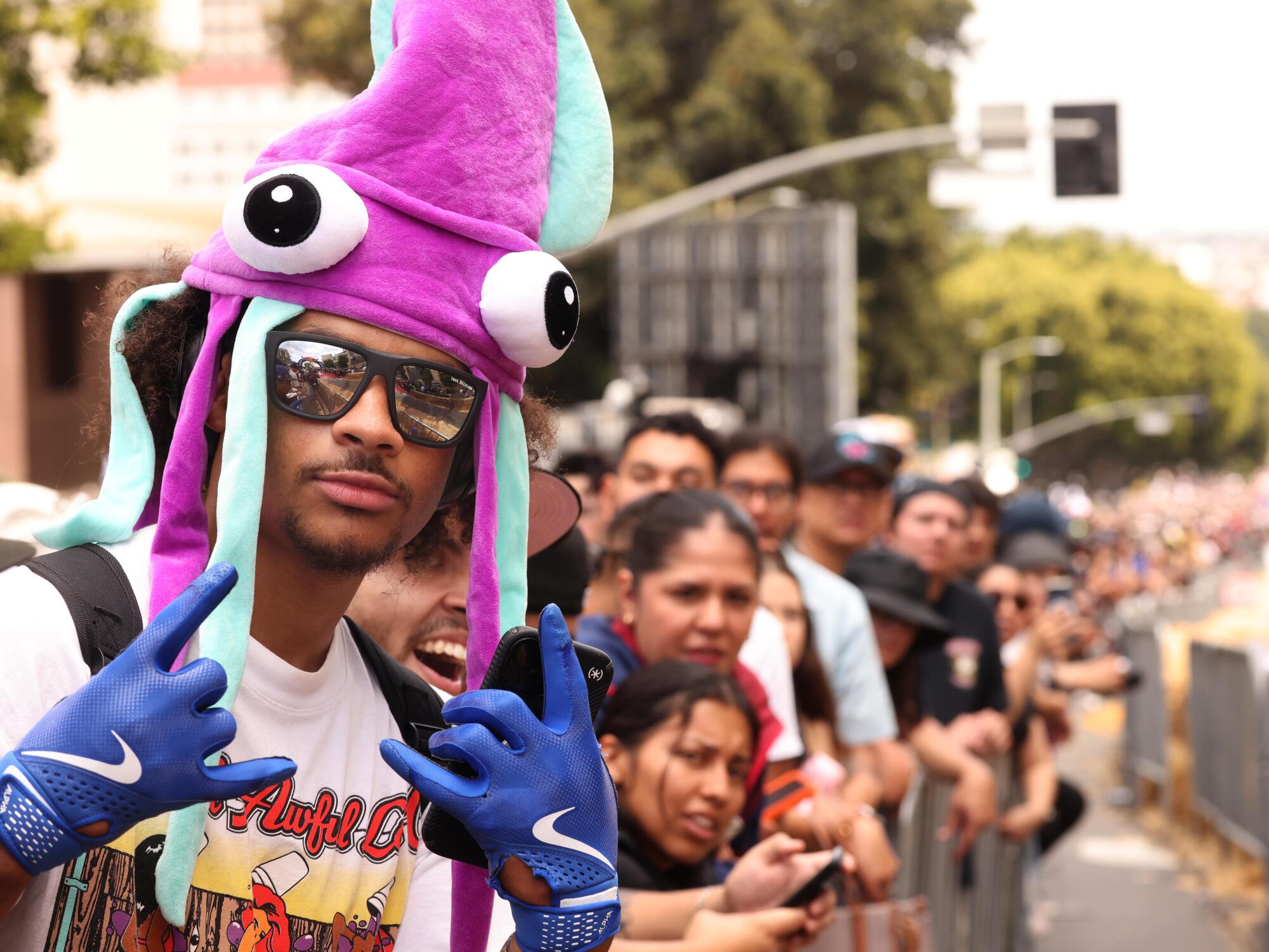 Elbert Watts, Jr., wearing a squid hat, joined hundreds of spectators who attended the Red Bull Soapbox Race.