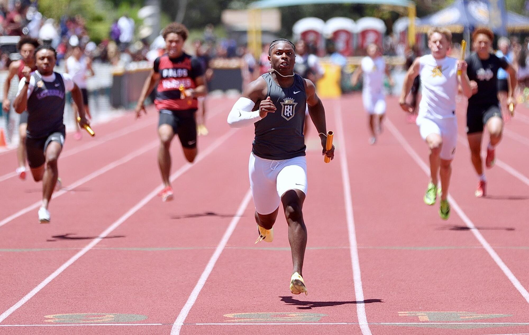 Servite’s Benjamin Harris sprints to the finish line in the Division 3 final of the 4x100 relay at Moorpark High.