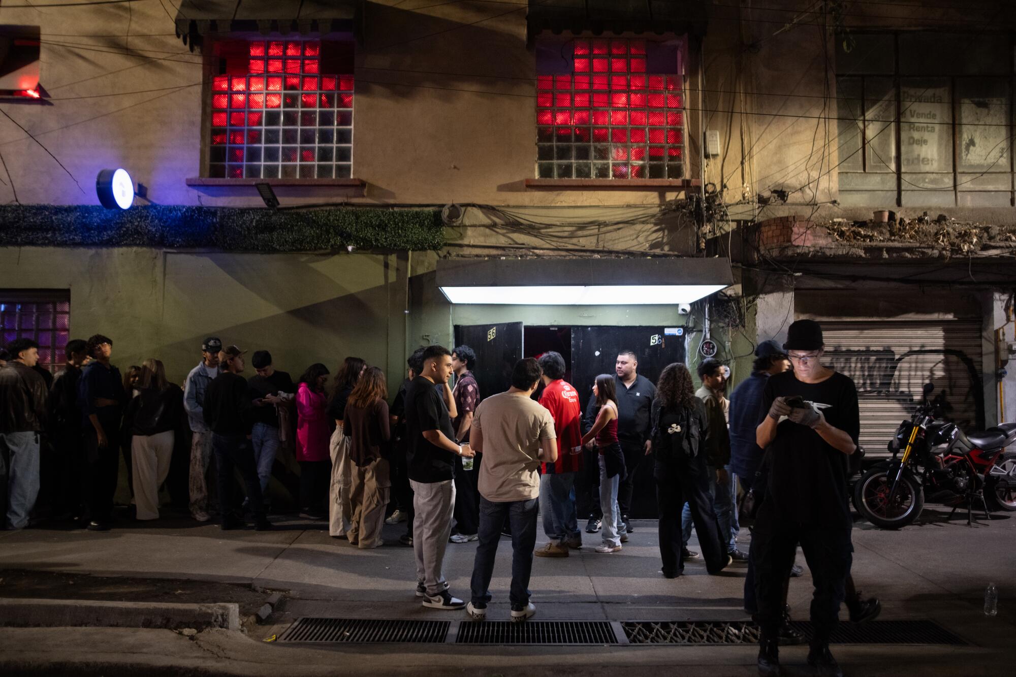 a crowd gathers on the street