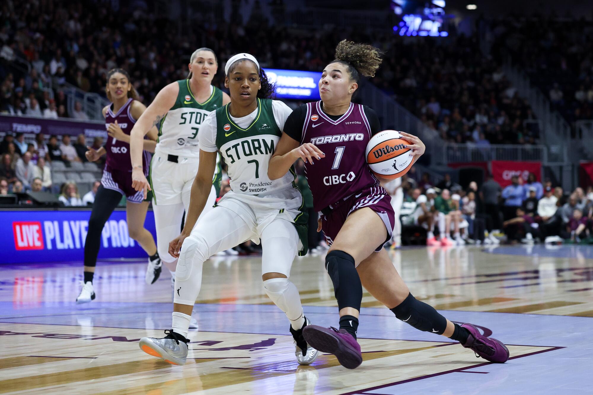 Tempo guard Kiki Rice drives past the Storm's Zia Cooke during expansion franchise Toronto's first win on Wednesday. 