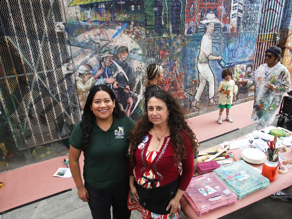 Santa Ana Council member Jessie Lopez, left, and Alicia Rojas in Santa Ana on Saturday, May 2, 2026.