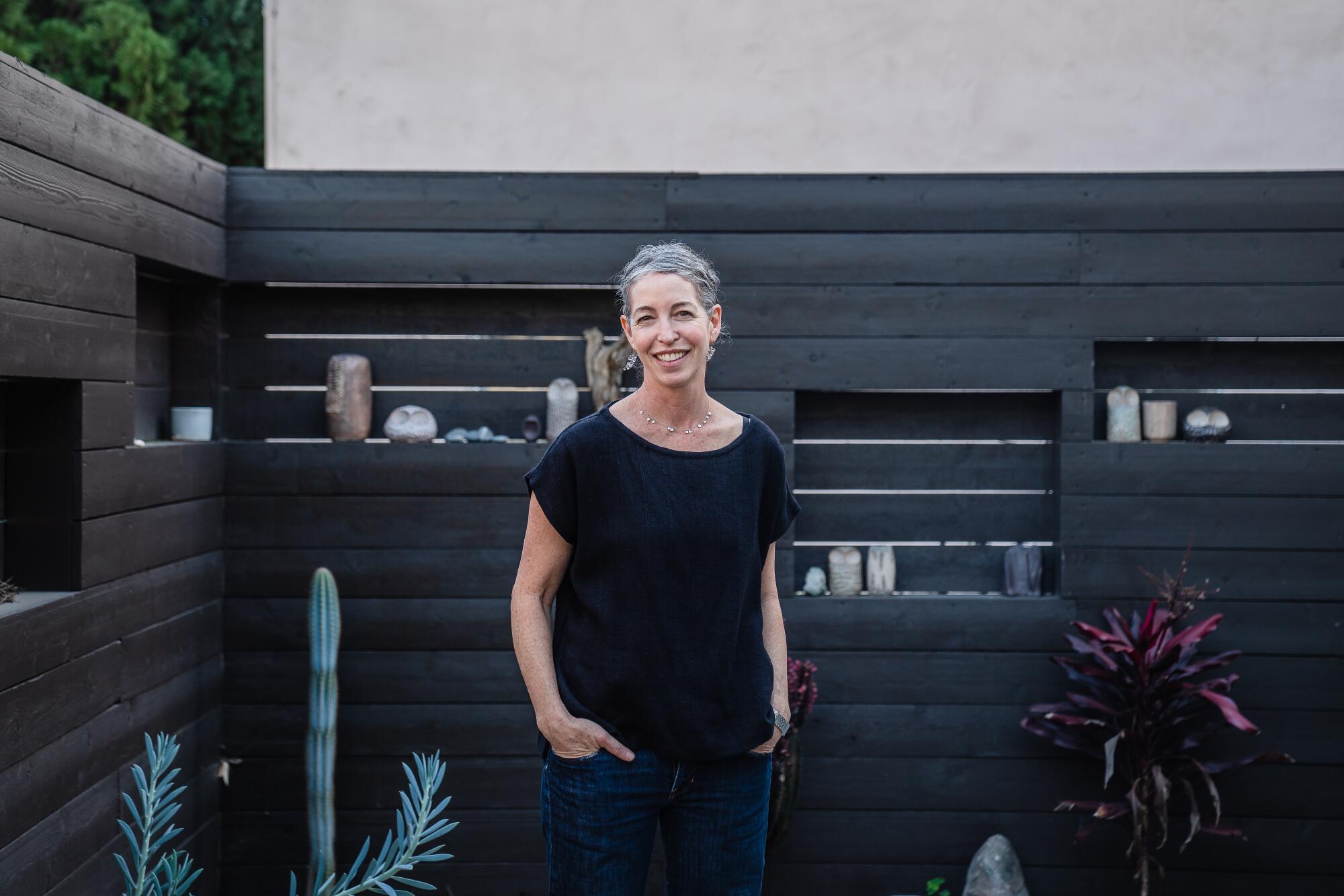 Artist Julie Burton stands outside her ADU in Silver Lake.