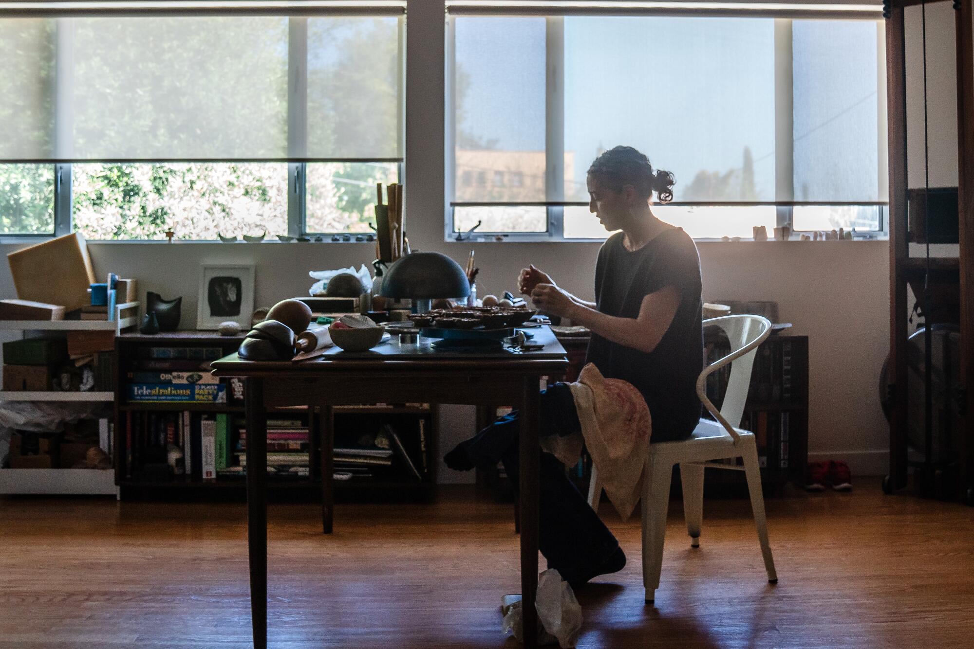 Artist Julie Burton makes a facet bowl at home in Los Angeles.