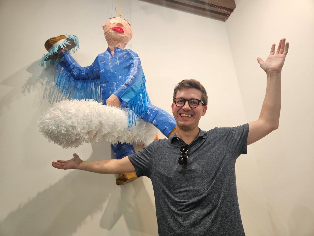 Mat Cusick originally created his piñata for a picnic between Amazon worker organizers. His design features Amazon founder Jeff Bezos riding a rocket and holding a cowboy hat, mimicking a scene from Dr. Strangelove.