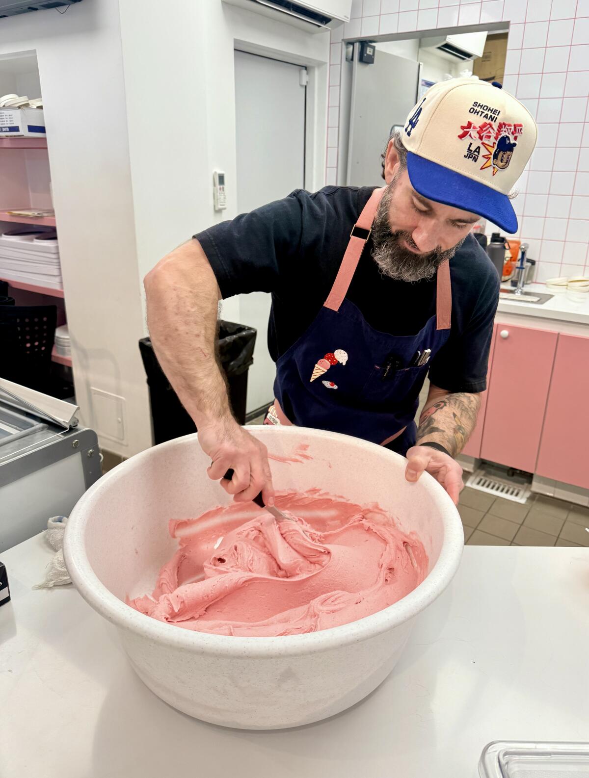 Bradley Ray mixes up a batch of strawberry ice cream for Henry's Secret Ice Cream
