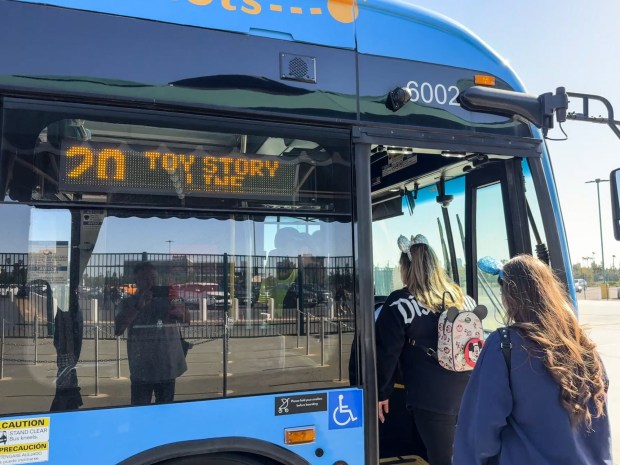 Bus riders take Anaheim Regional Transportation (ART) buses shuttles from the Toy Story parking lot to the Disneyland Resort on Thursday, January 29, 2026, in Anaheim, CA. The Anaheim Transportation Network's board voted Wed. Jan. 28 to "wind down" operations, with the last day of shuttling planned for March 31. The bus system moves 8 million riders a year around the resort area. (Photo by Jeff Gritchen, Orange County Register/SCNG)