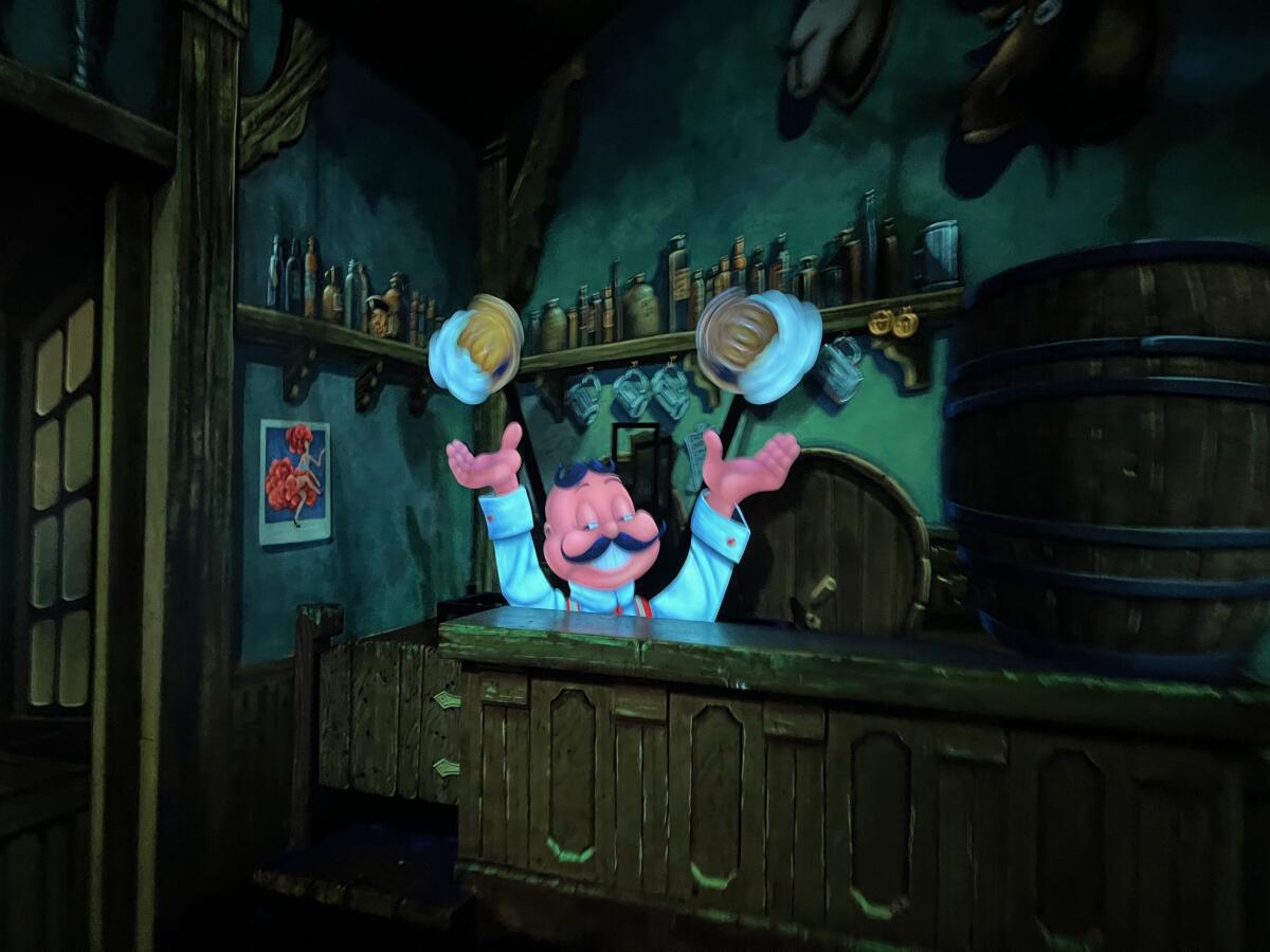 A character in a theme park ride juggling mugs of beer. 