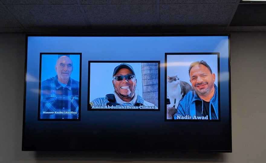 Photos of victims of a shooting at the Islamic Center of San Diego in Clairemont are shown on a TV screen; community member Mansour Kaziha, security guard Amin Abdullah, and community member Nadir Awad were killed in the attack. May 19, 2026