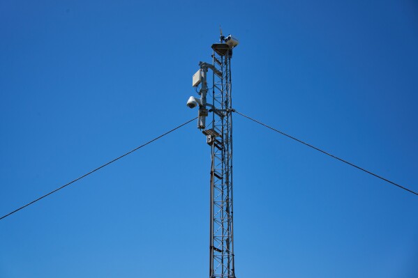 A WhaleSpotter device that scans the bay around the clock for whale blows and heat signatures is mounted on a tower on Angel Island in San Francisco Bay, Tuesday, May 19, 2026. (AP Photo/Annika Hammerschlag)