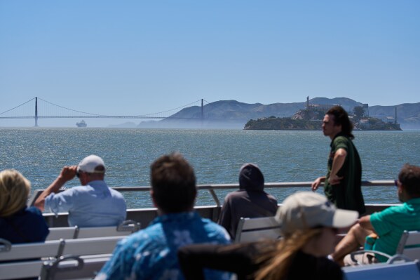 Passengers ride a San Francisco Bay ferry, Tuesday, May 19, 2026. (AP Photo/Annika Hammerschlag)